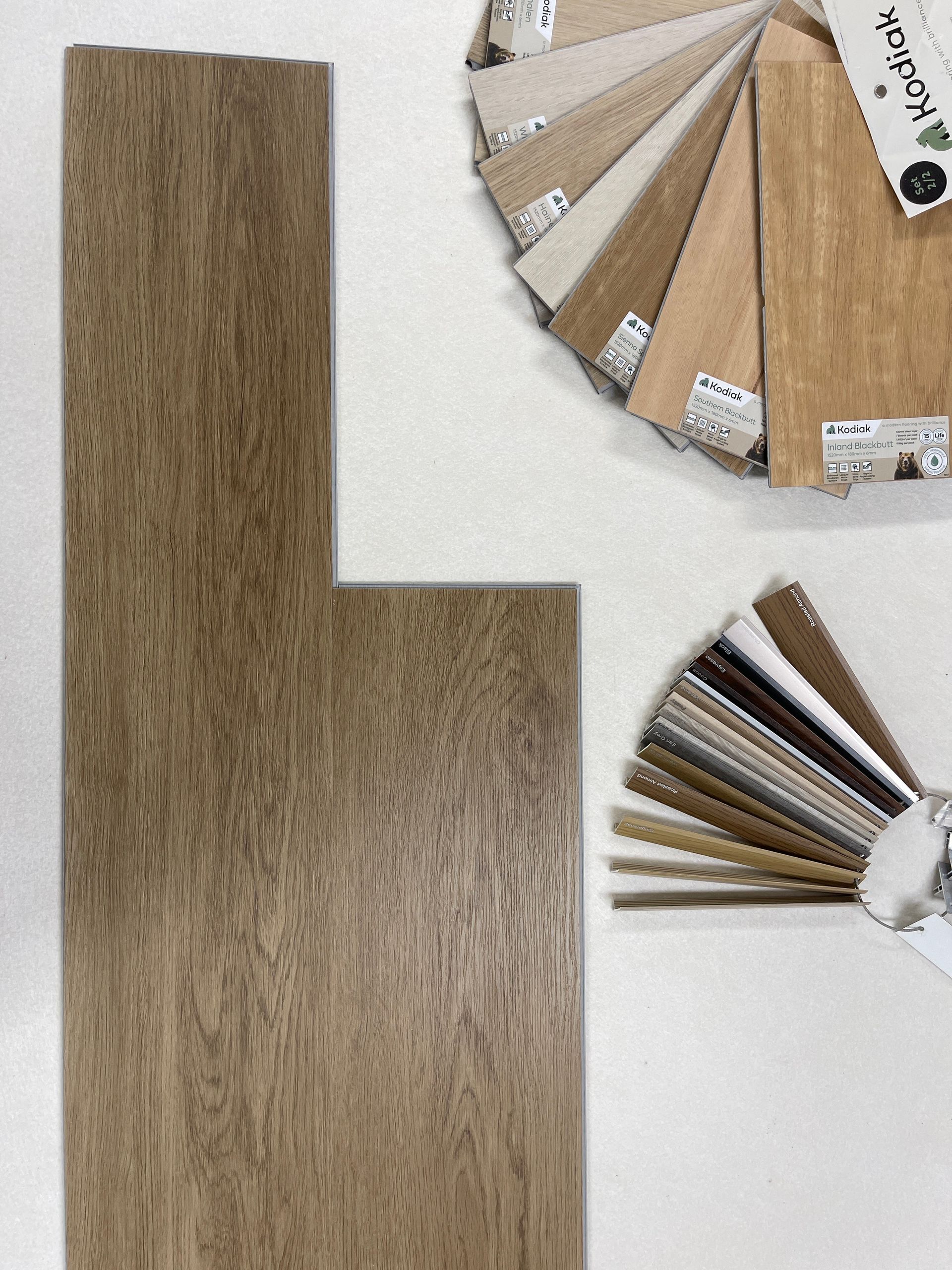 Wood flooring sample with color swatches.