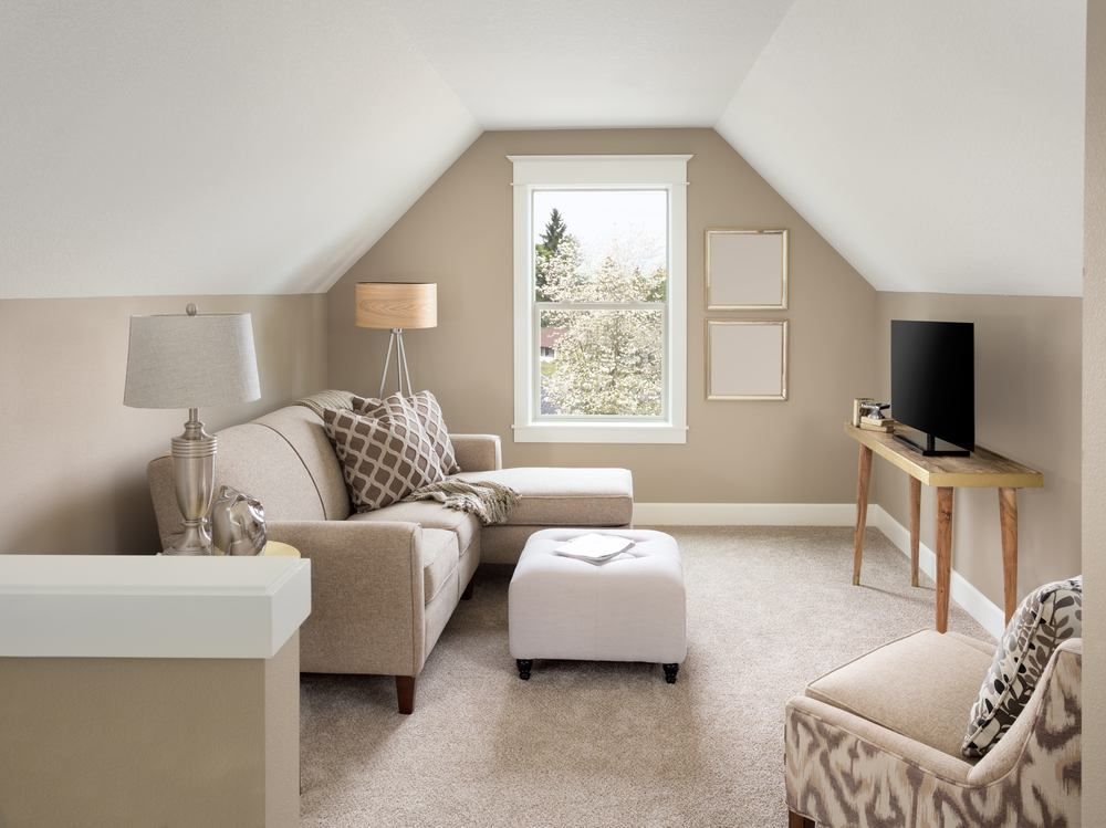 Cozy Attic Living Room with Beige Sofa, Window, and Tv on A Small Table — Gava Floor Centre in Byron Bay, NSW