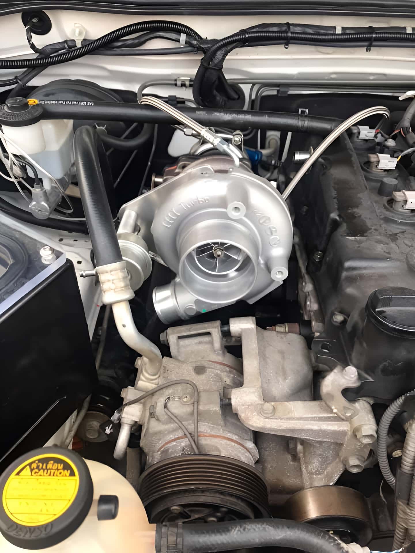 A Turbocharger Is Installed In The Engine Of A Car — Cannon Automotive Services In East Maitland, NSW