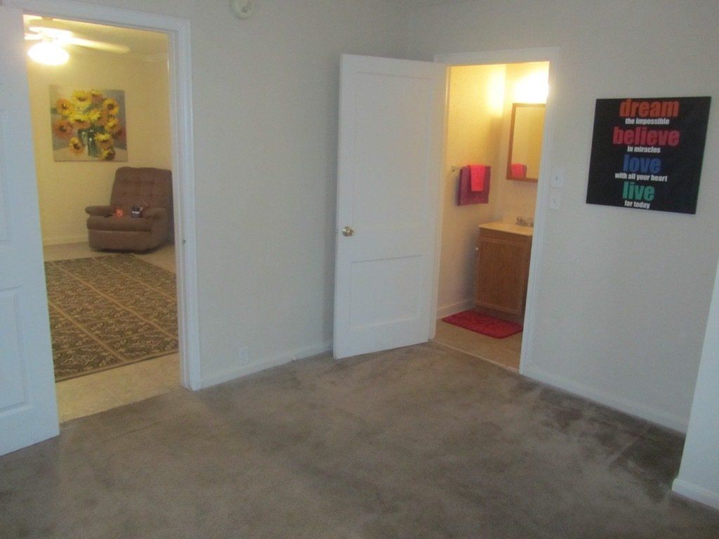 A room with a sign on the wall that says 