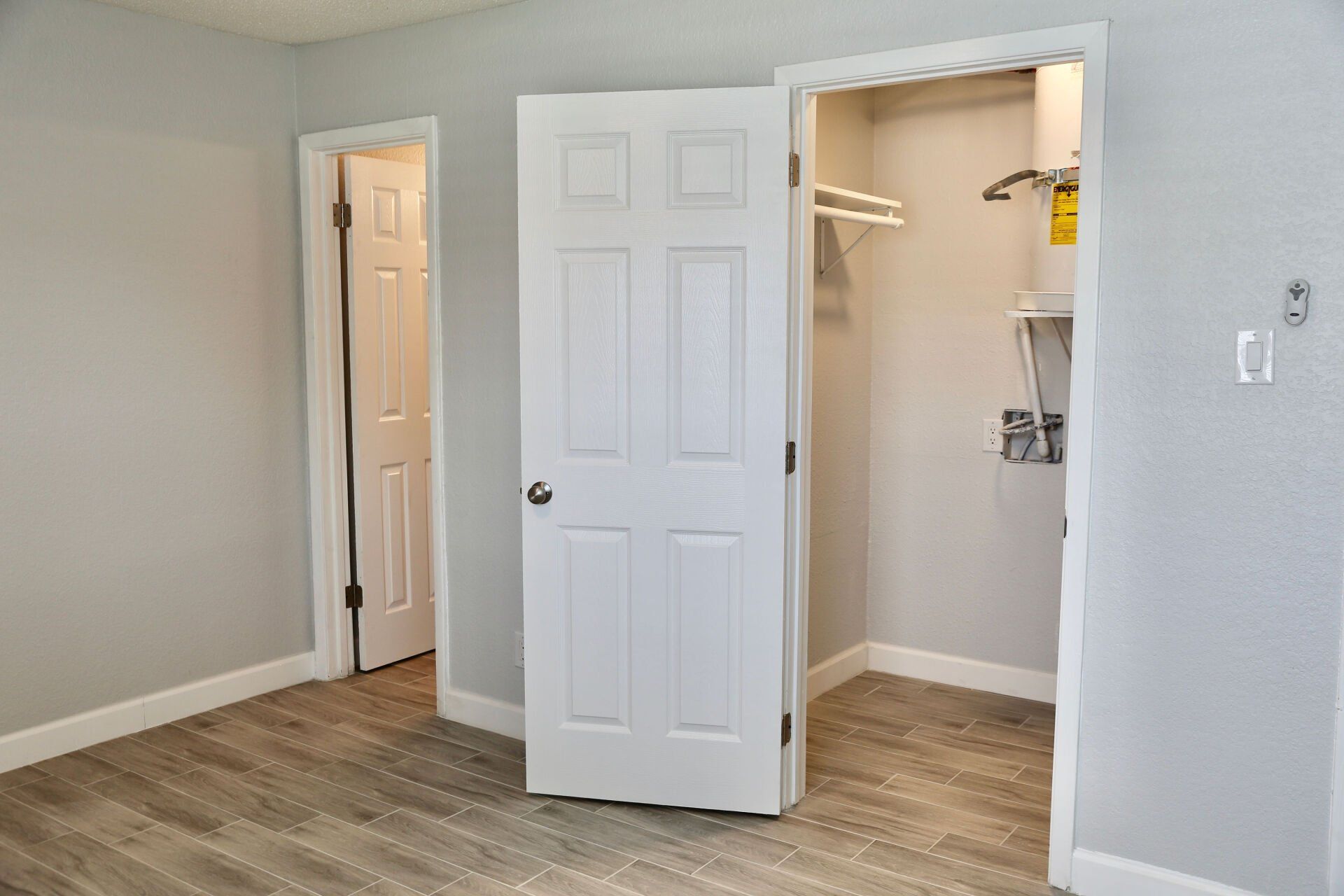 There is a closet in the middle of the room.