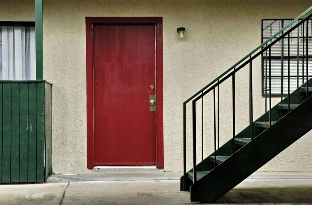 red door and outdoor staircase at Greenbriar Terrace Apartments in Amarillo, TX