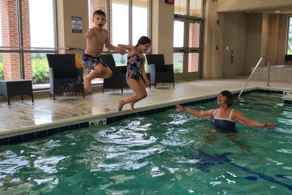 A grandma and her grandkids enjoy the Aquatic Center at Wesley Willows