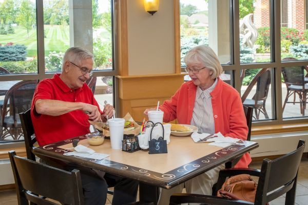 Residents enjoying a meal at the Wesley Willows bistro dining room