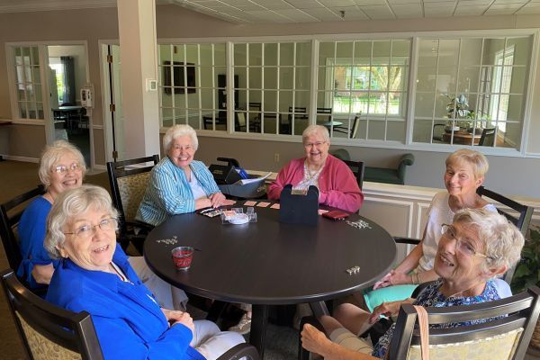 Residents play a card game at Peterson Meadows, a senior living community in Rockford, IL