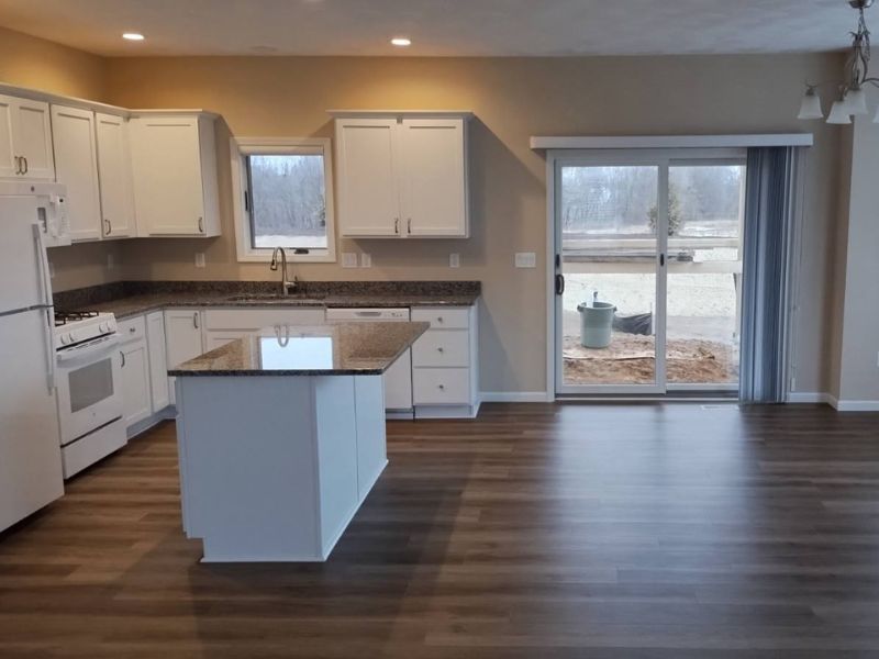 A kitchen and dining area in a new construction home