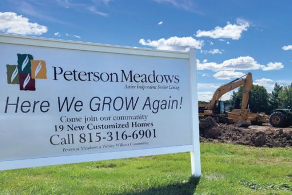 Sign advertising new 19 new construction homes at Peterson Meadows