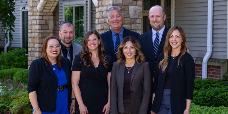 The Leadership Team at Wesley Willows poses for a photo.