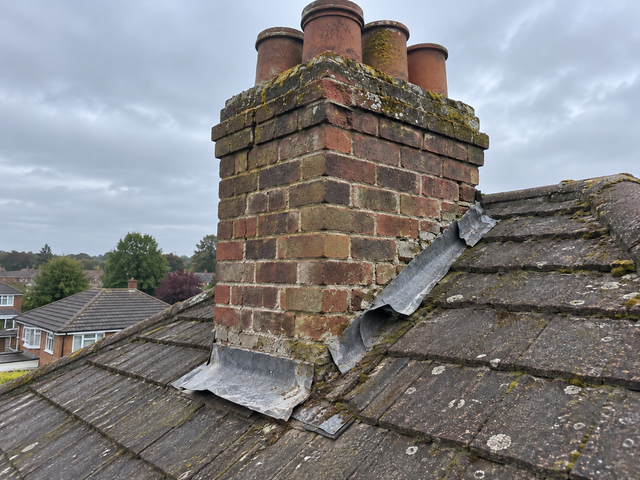 Chimney stack with cracked brickwork and failed pointing