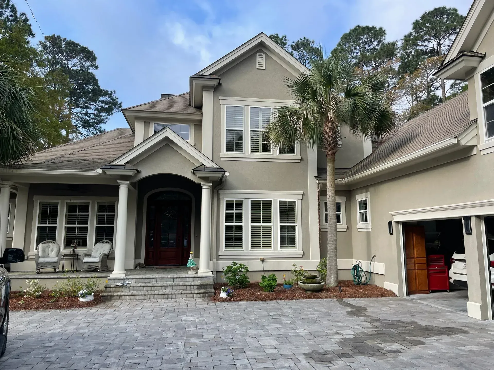 A living room with two couches, a coffee table, and a built-in bookshelf.