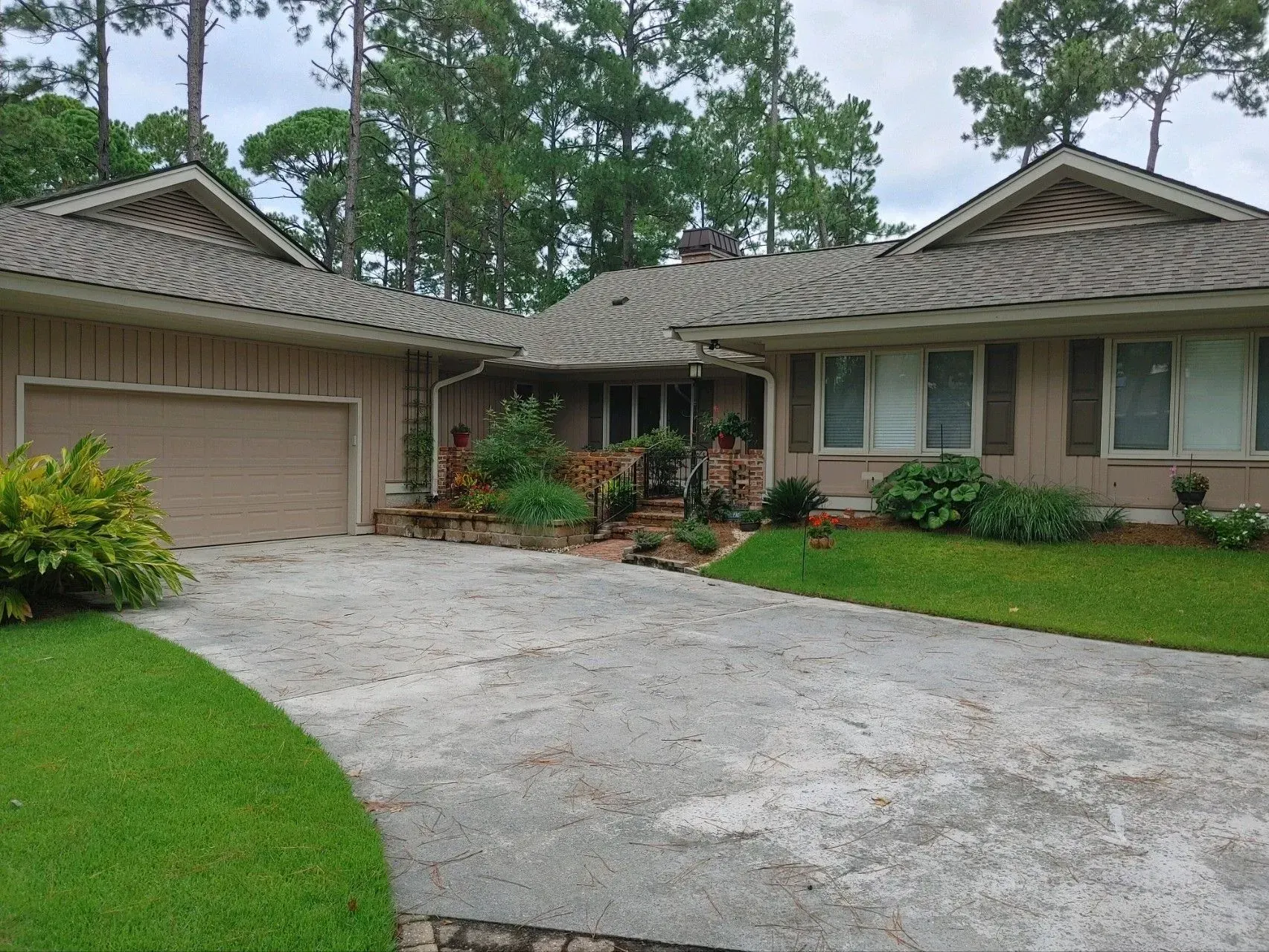 A living room with two couches, a coffee table, and a built-in bookshelf.