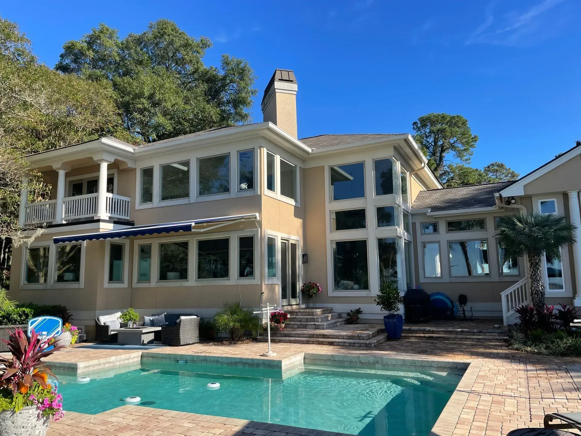 A living room with two couches, a coffee table, and a built-in bookshelf.