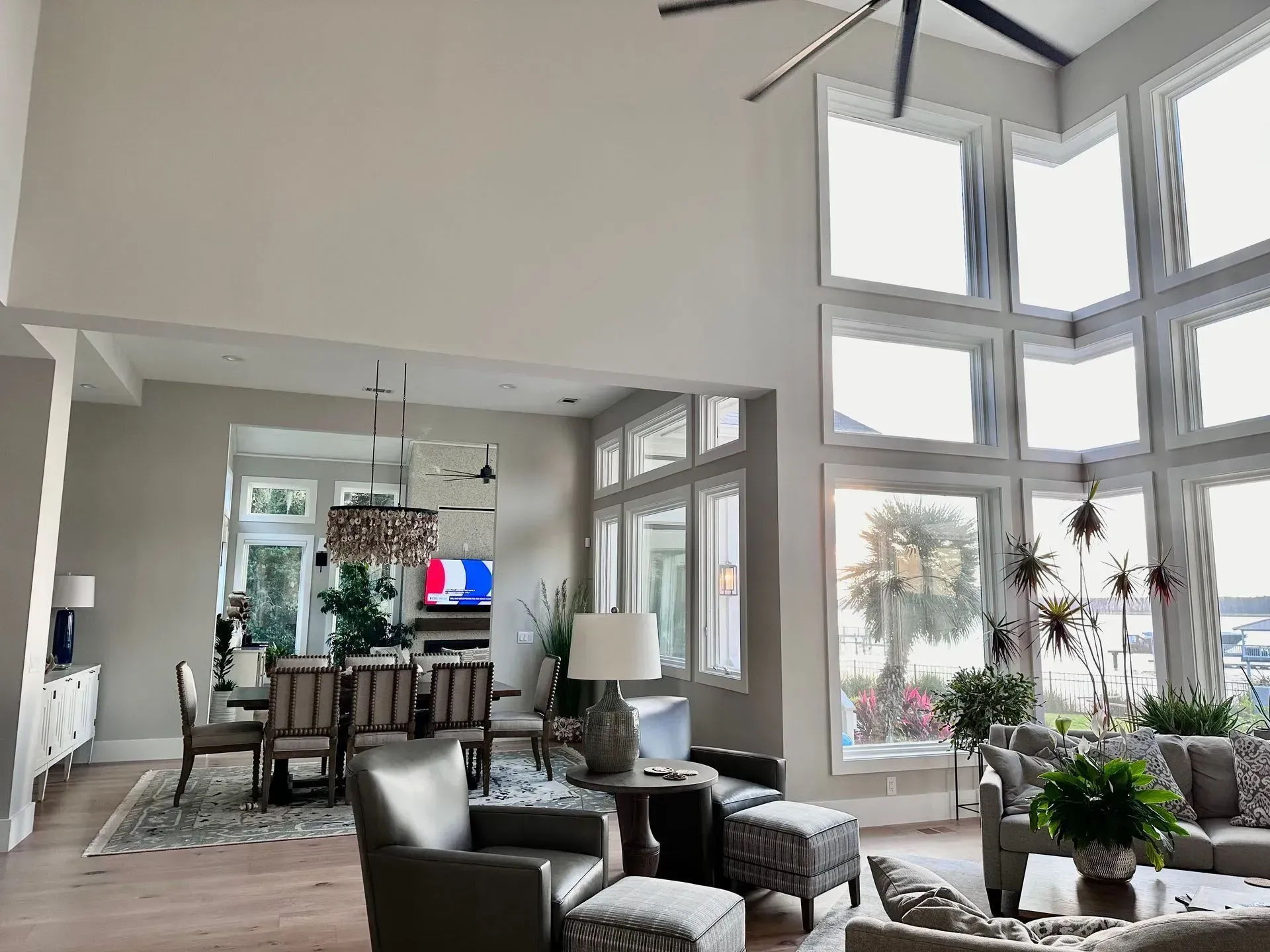 White sectional sofa in a living room with gray walls and built-in white shelving.
