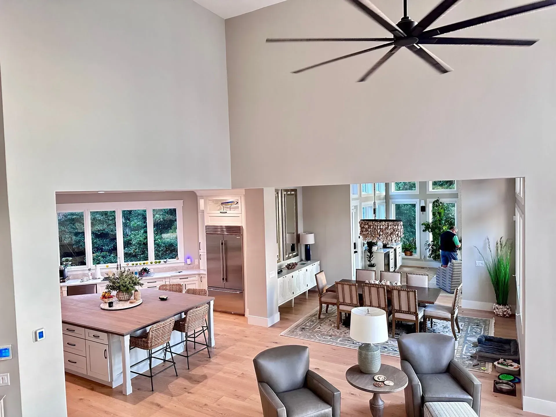 White sectional sofa in a living room with gray walls and built-in white shelving.