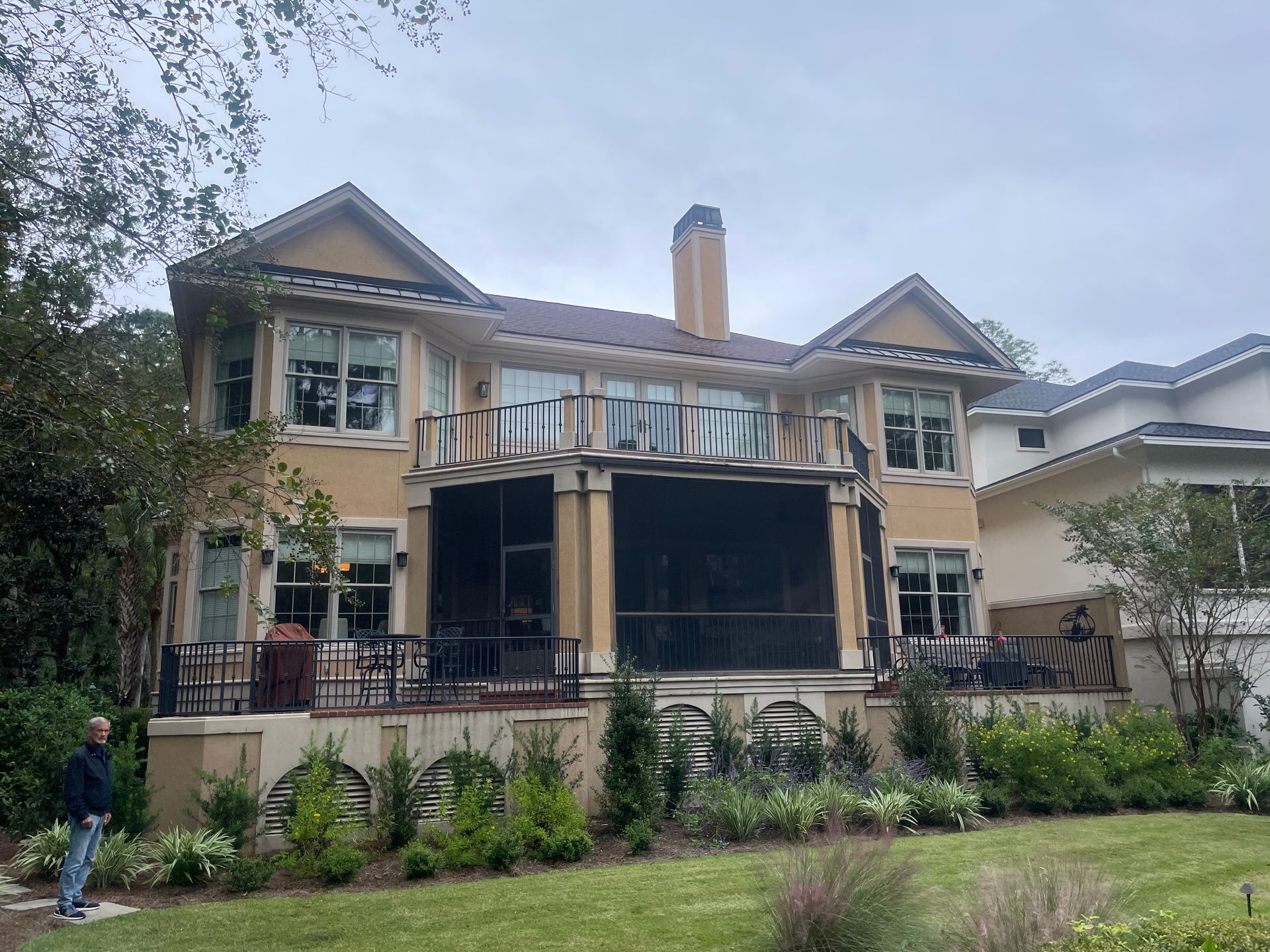 A living room with two couches, a coffee table, and a built-in bookshelf.