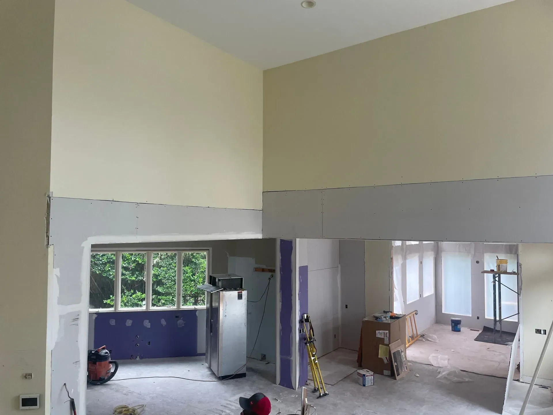 A living room with two couches, a coffee table, and a built-in bookshelf.