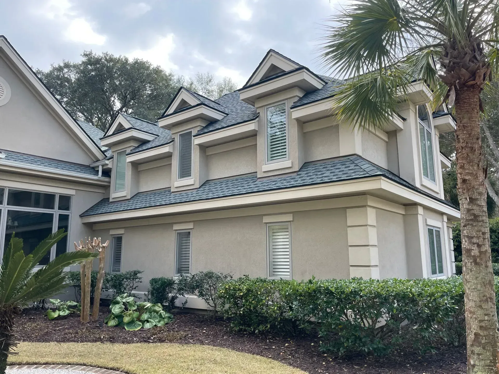 A living room with two couches, a coffee table, and a built-in bookshelf.
