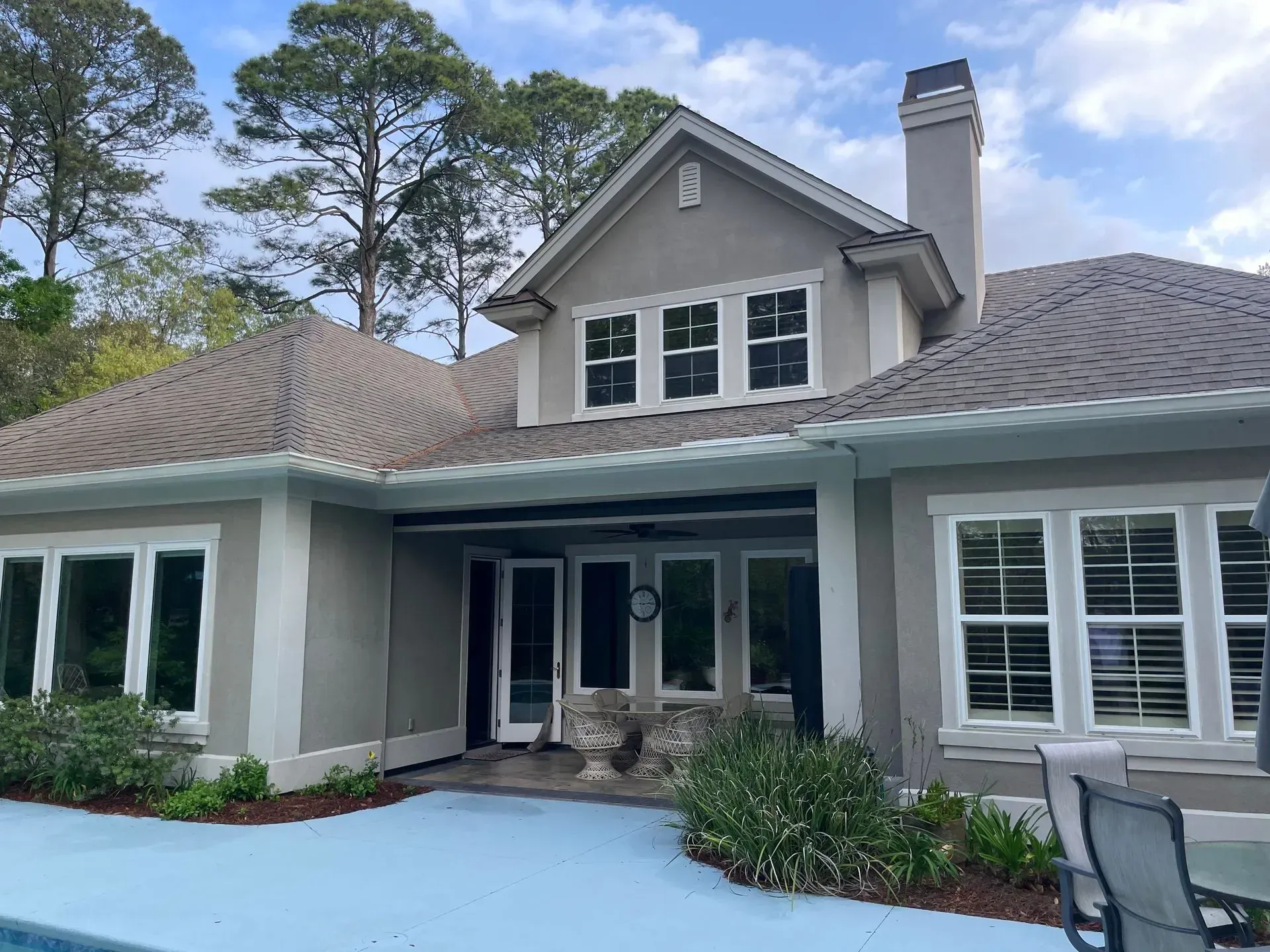 A living room with two couches, a coffee table, and a built-in bookshelf.