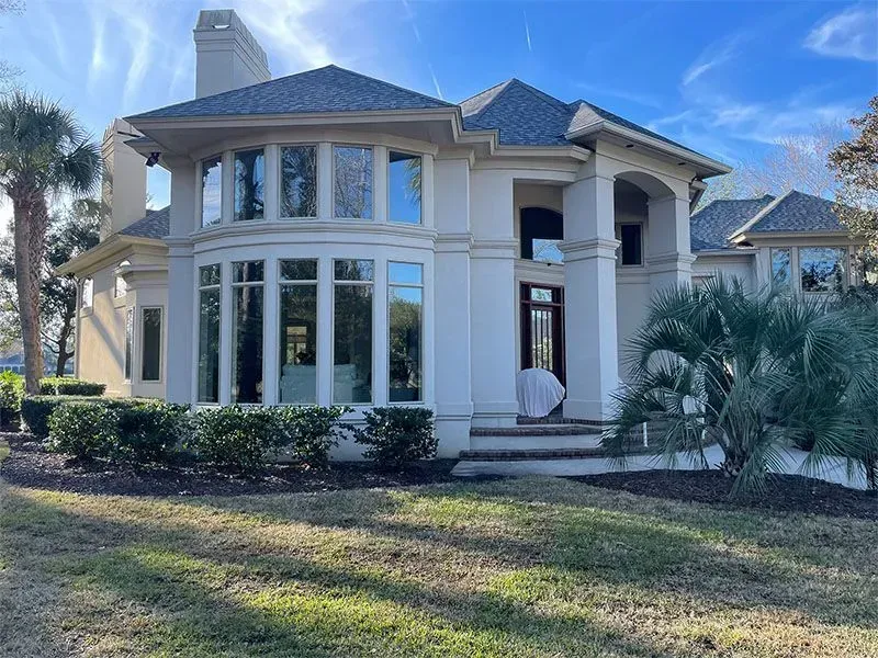 A living room with two couches, a coffee table, and a built-in bookshelf.