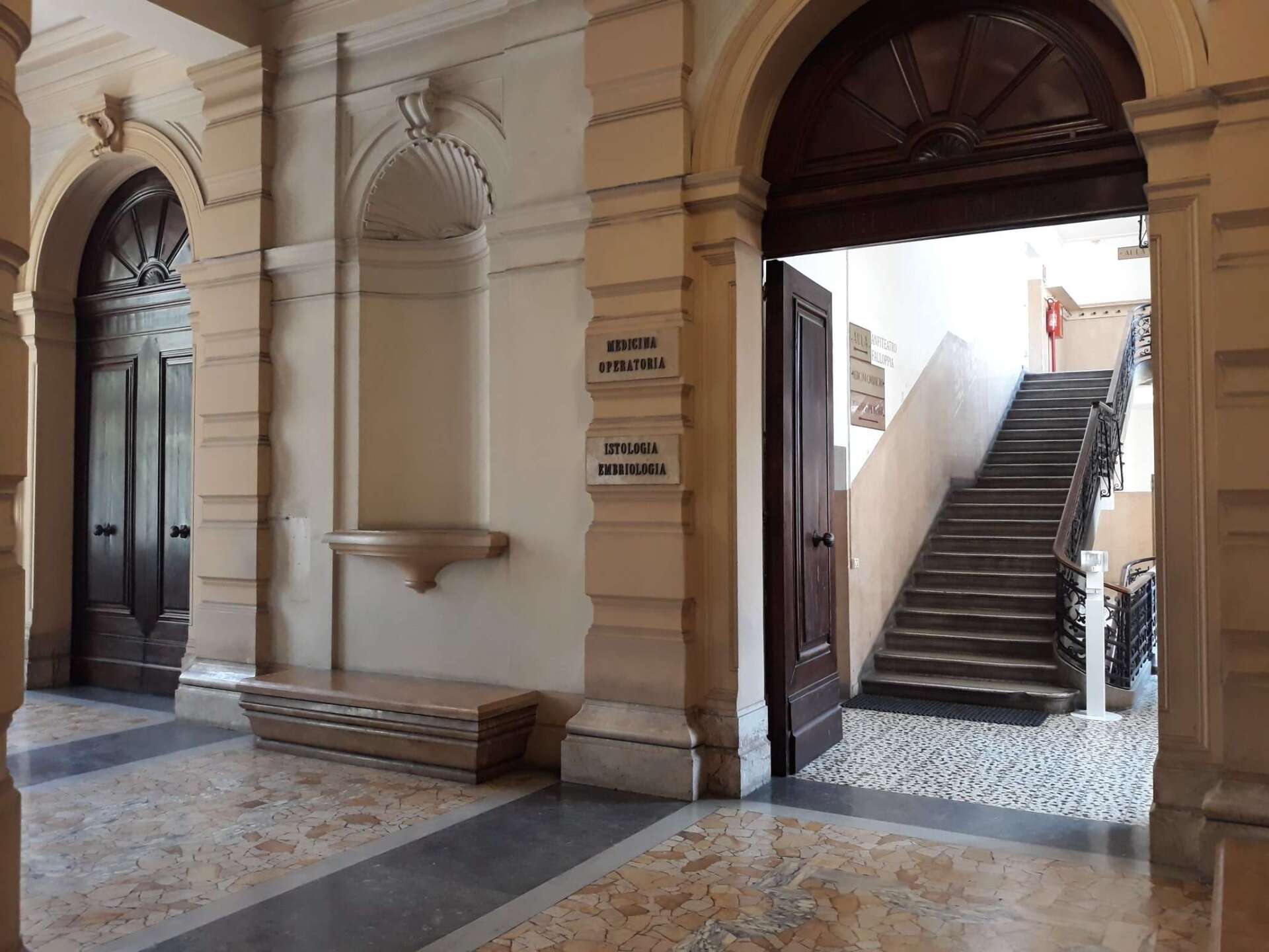 A building with stairs leading up to the second floor