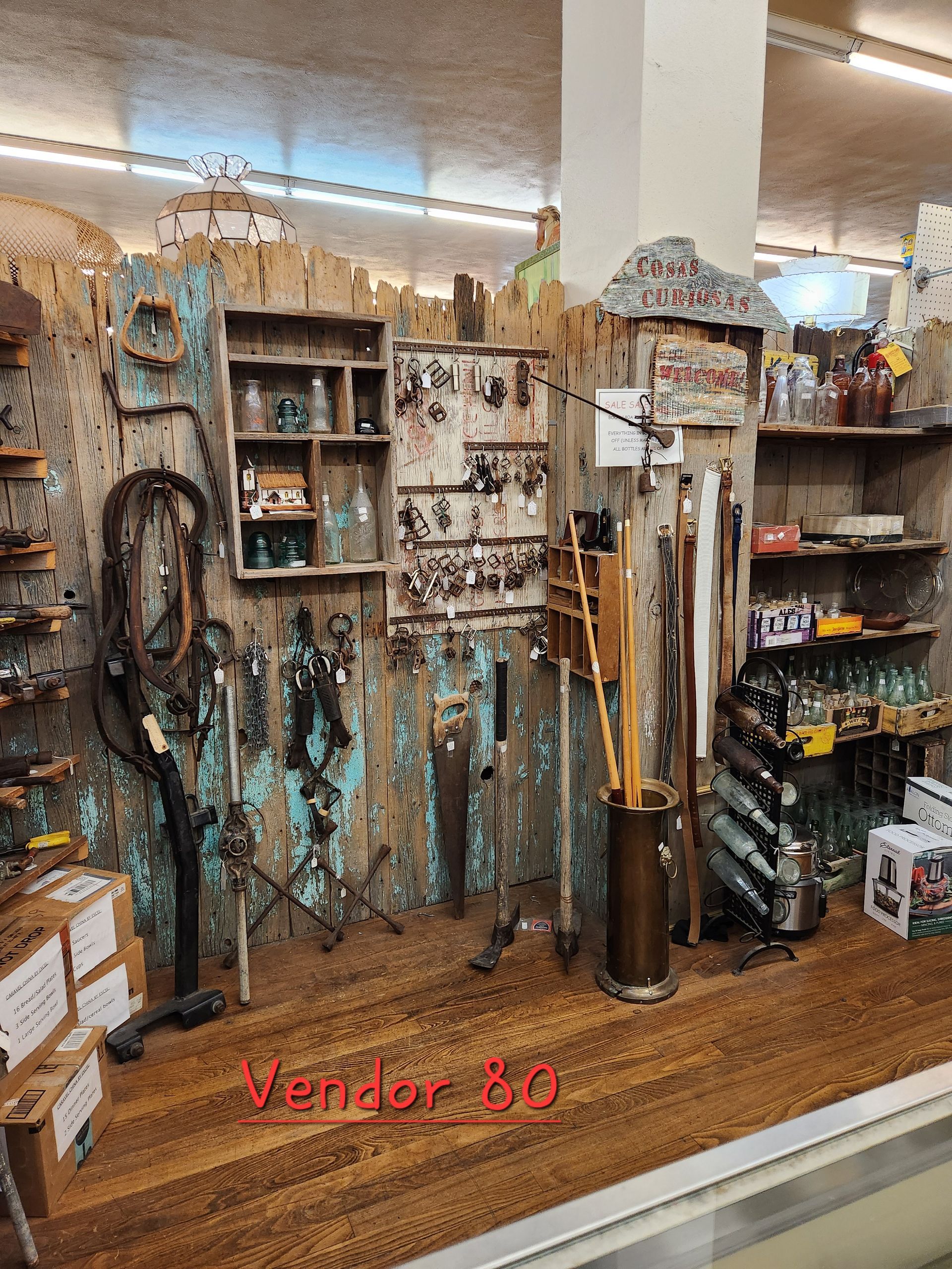 A store with a lot of tools on display and a sign that says vendor 80.