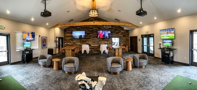 A close up of a bride in a wedding dress holding her veil.