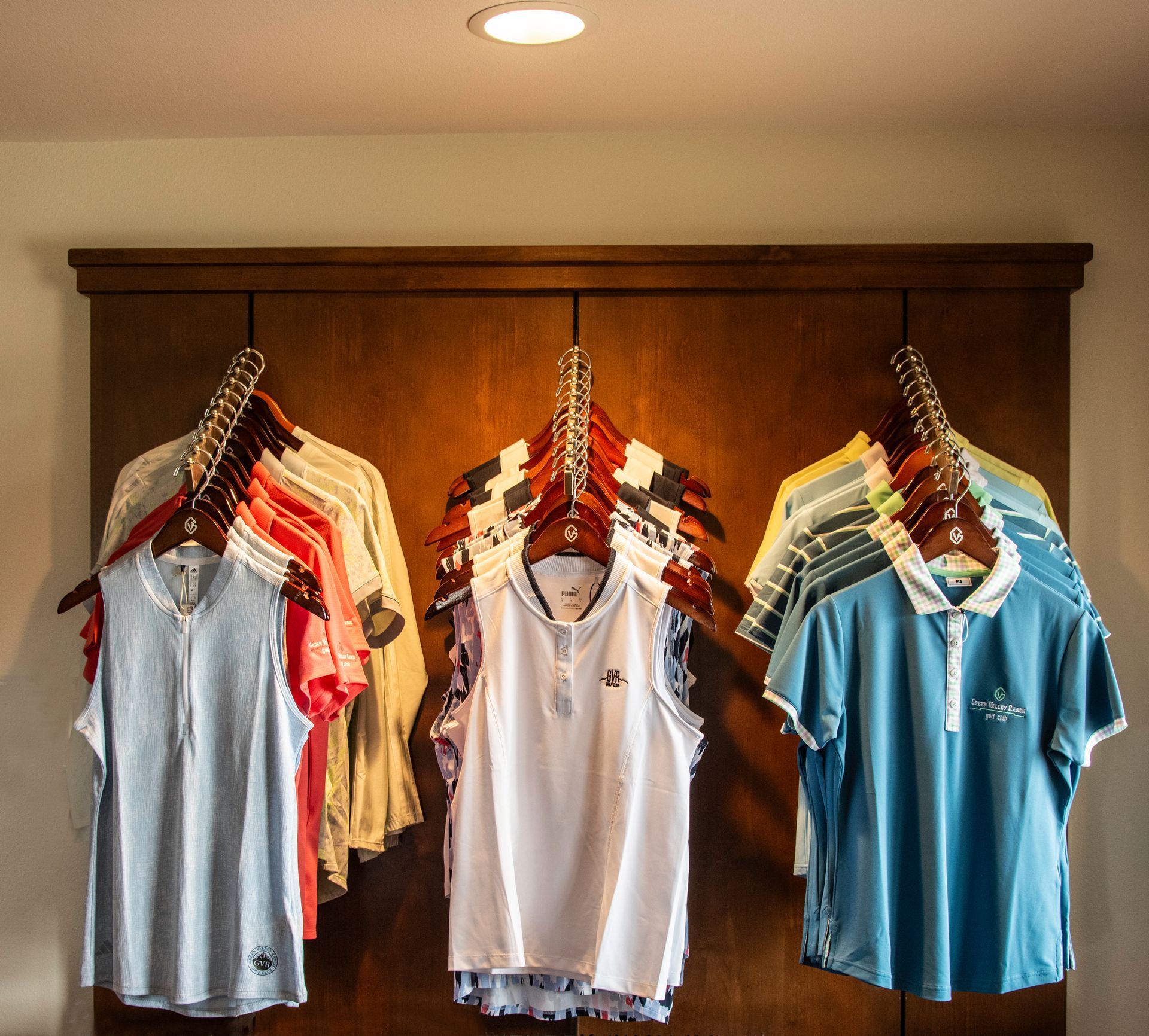 A golf course with a green and trees in the background