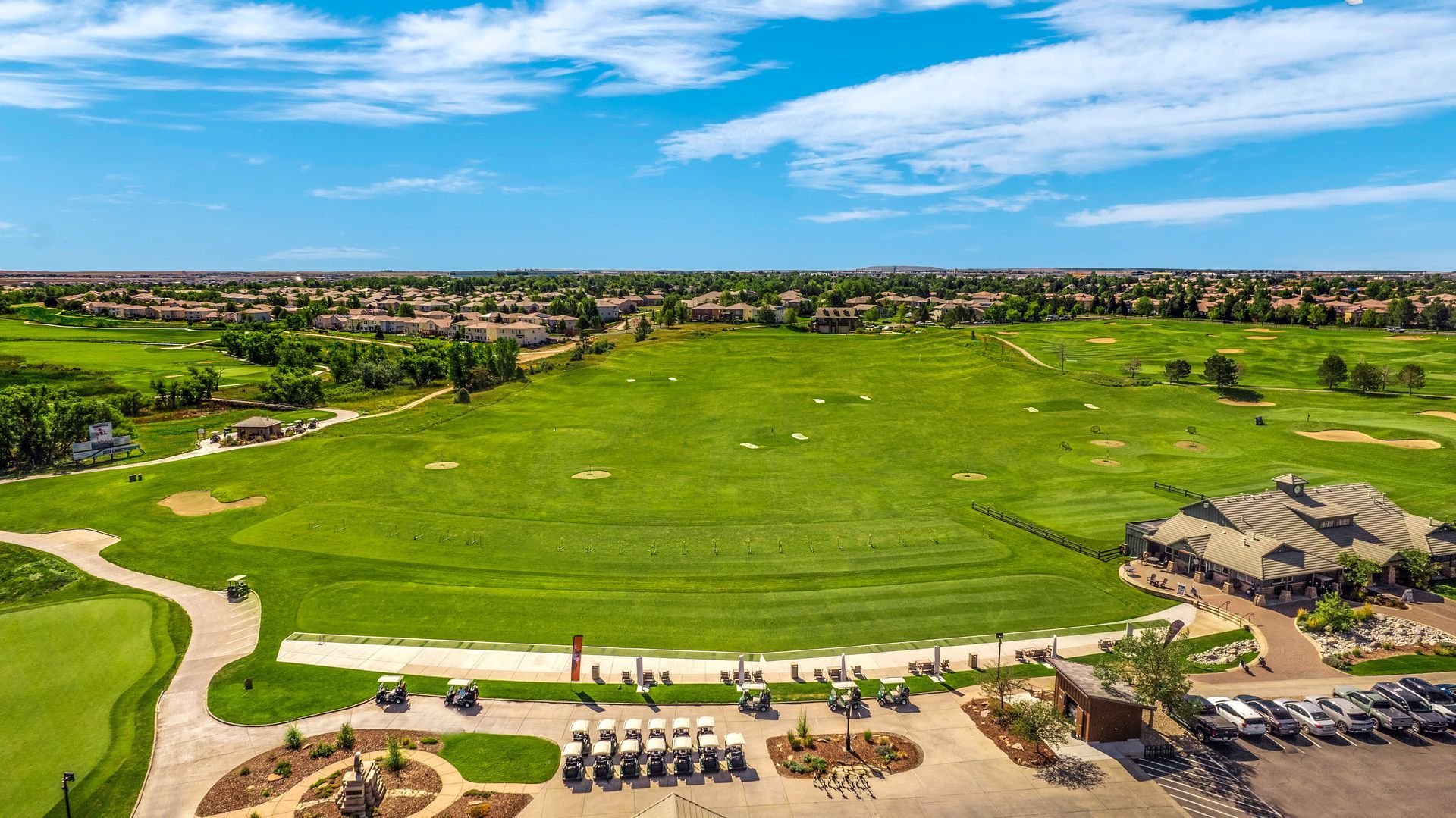 A view of a golf course from inside a building.
