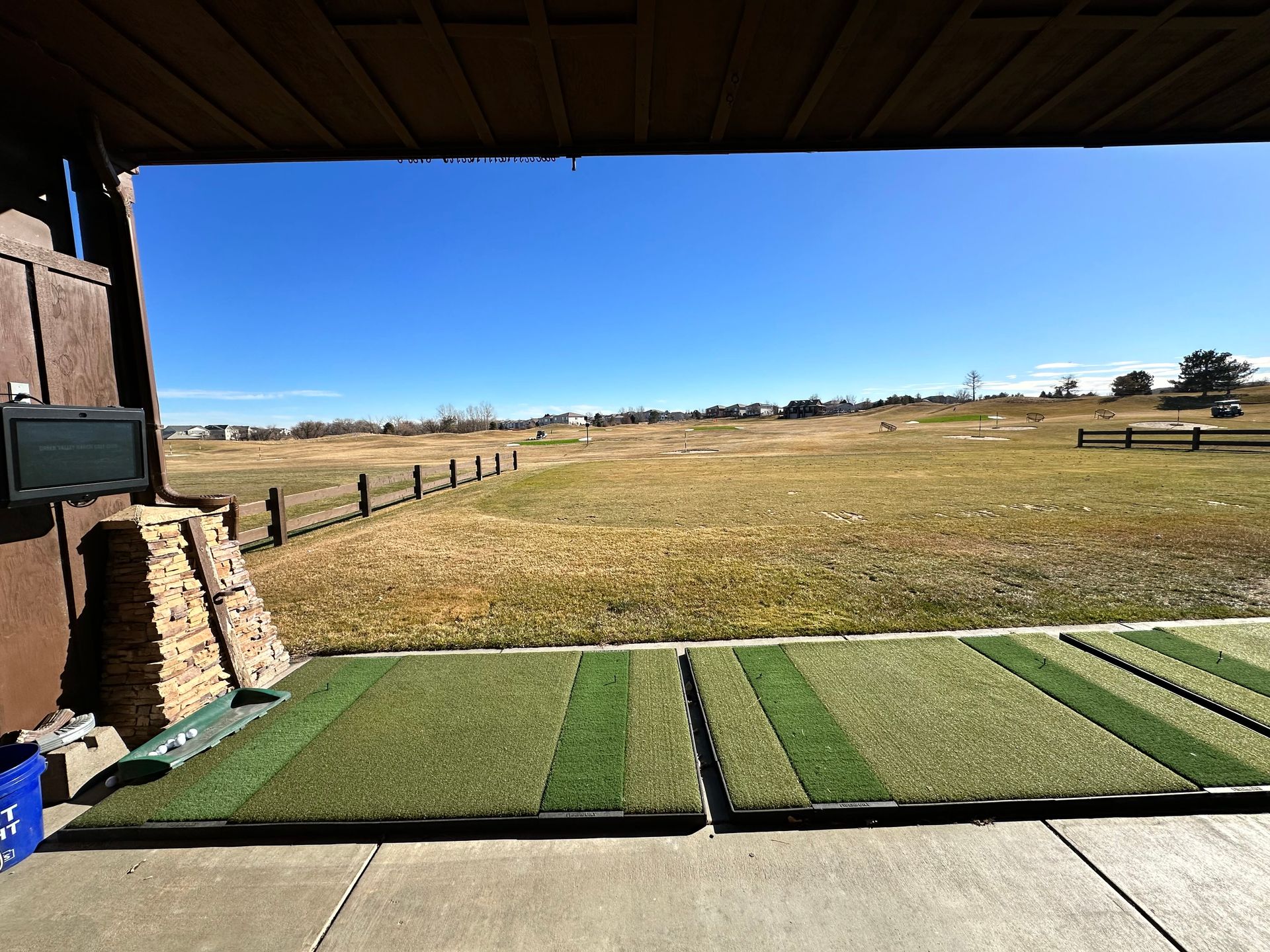 A close up of a bride in a wedding dress holding her veil.