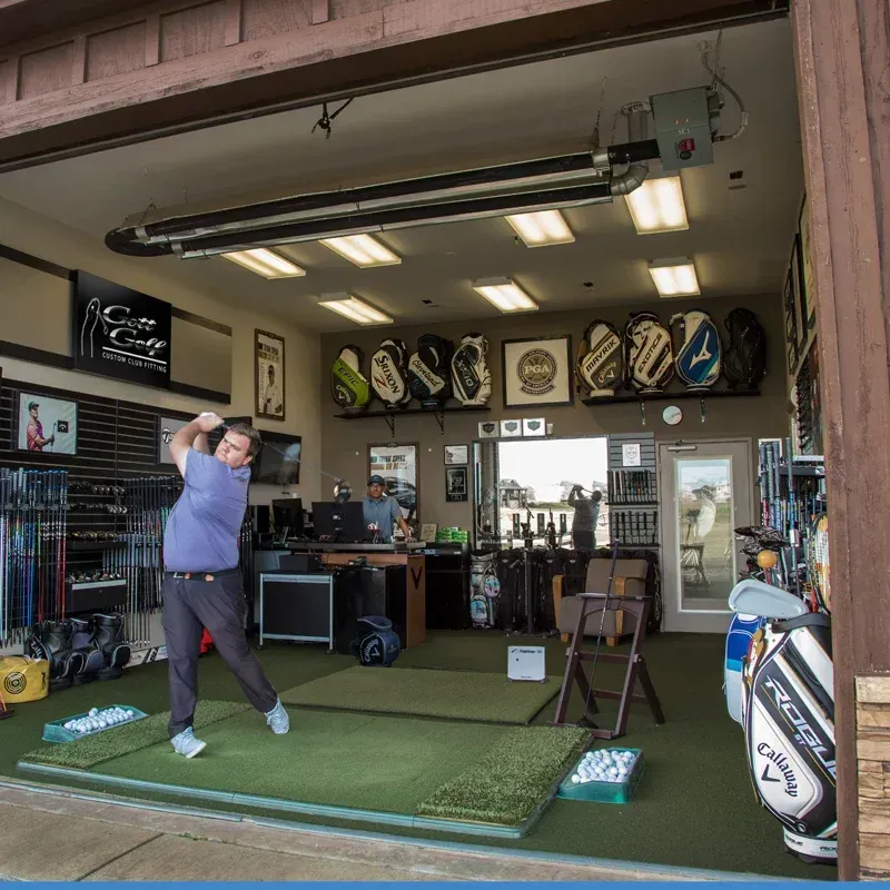 A close up of a bride in a wedding dress holding her veil.