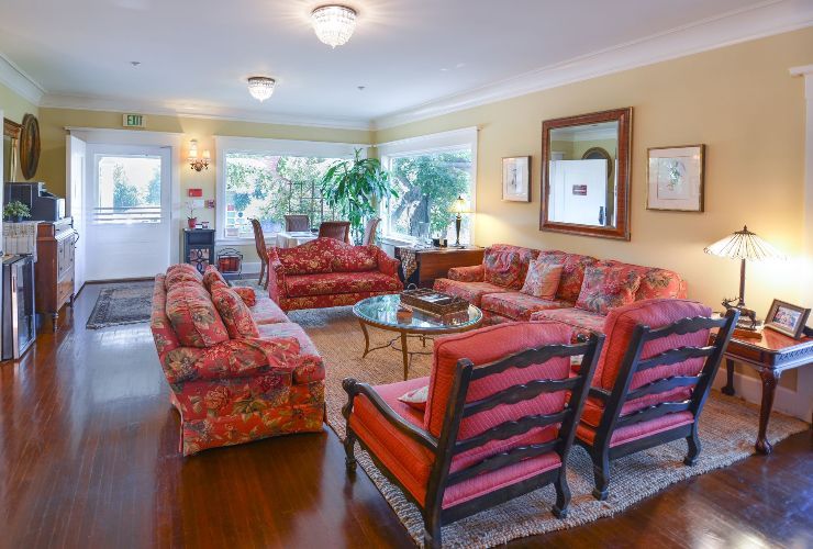 A living room with a lot of furniture and a large window