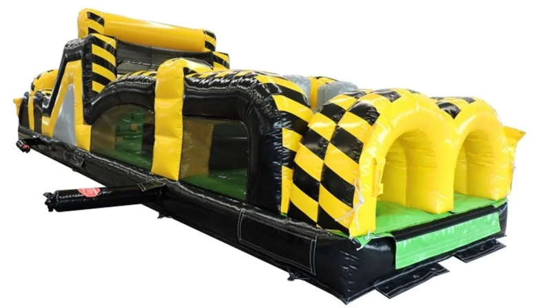 Yellow black full throttle inflatable obstacle course at a park in the Kent, WA area