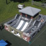 An aerial view of a large inflatable structure in a park.