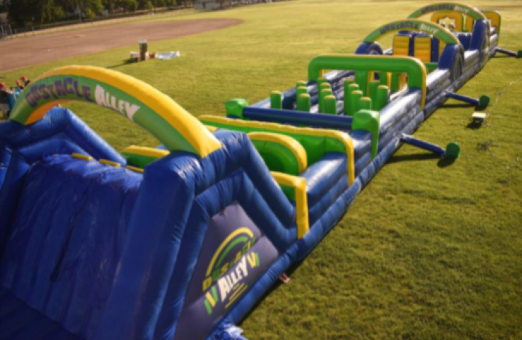 A large inflatable obstacle course with the word valley on it