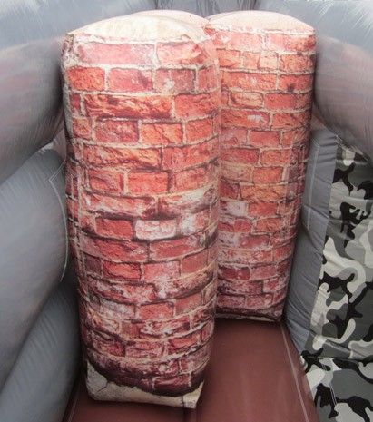 Two inflatable brick walls are sitting next to each other