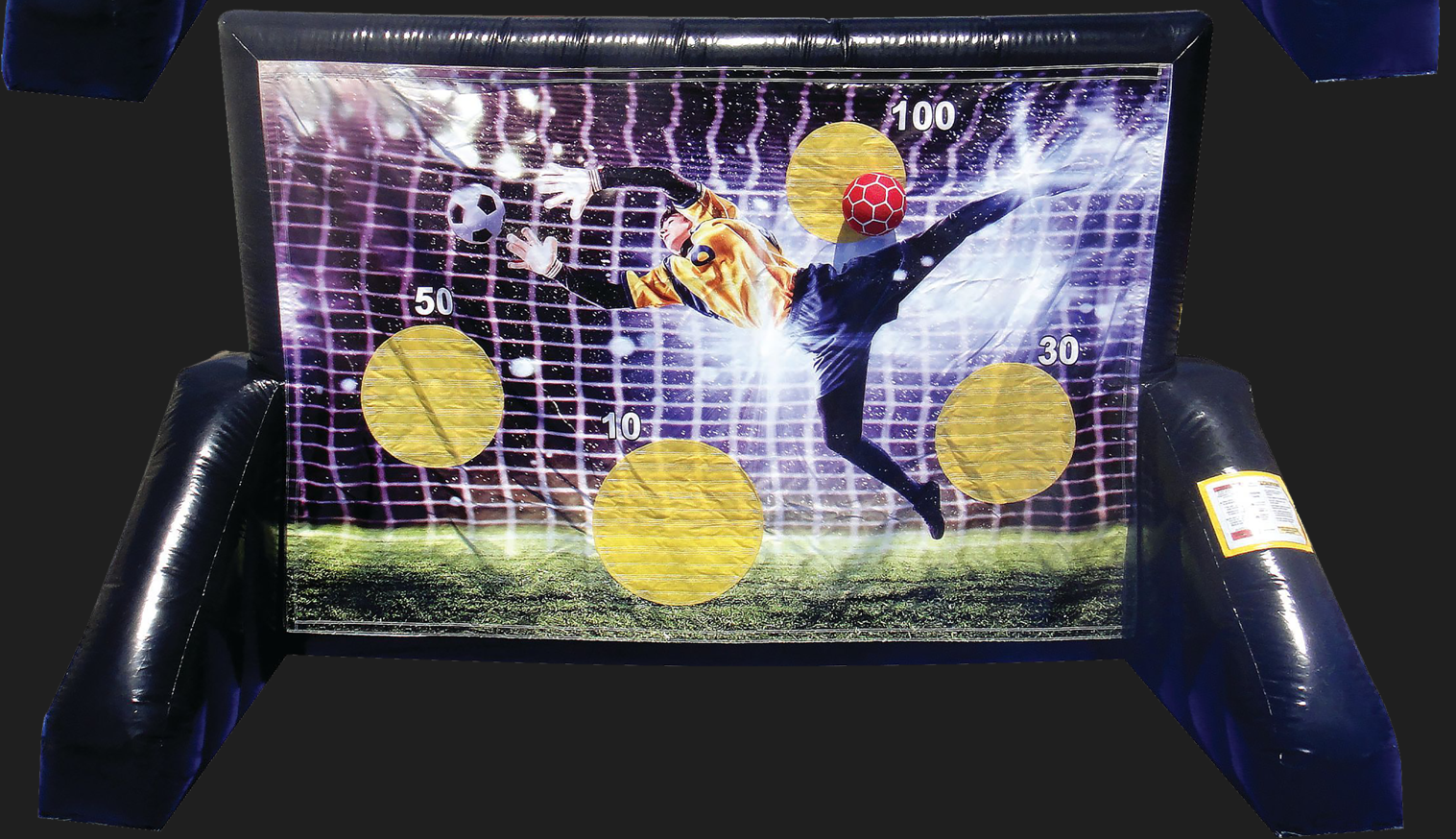 A soccer goalie is kicking a soccer ball at a target.