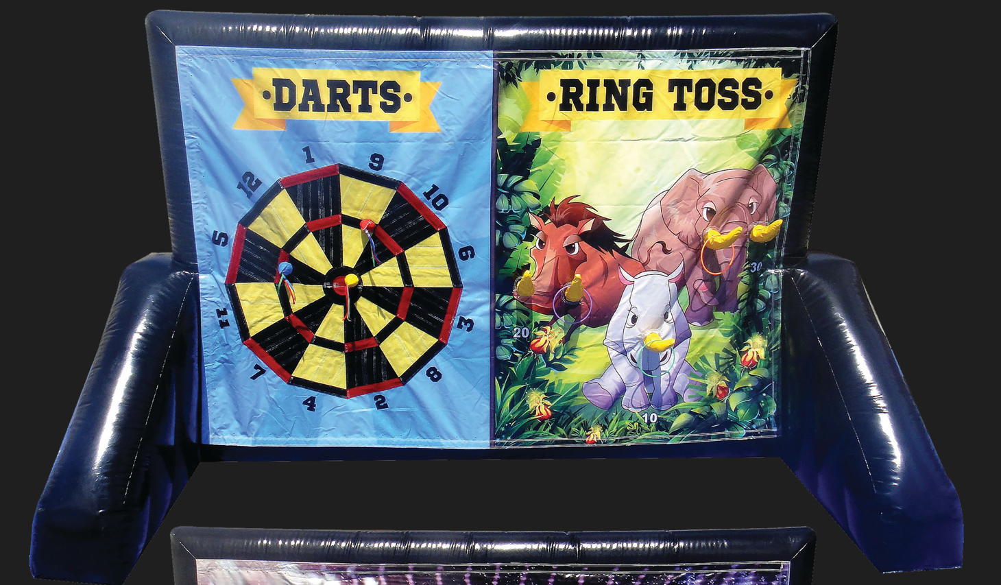 A dart board and a ring toss board are sitting on top of each other.