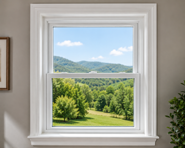 Open window with a green mountain landscape and blue sky outside.