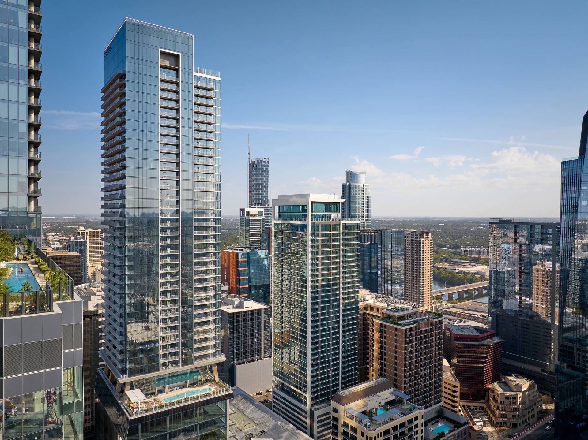Skyscrapers in a city skyline under a clear blue sky.