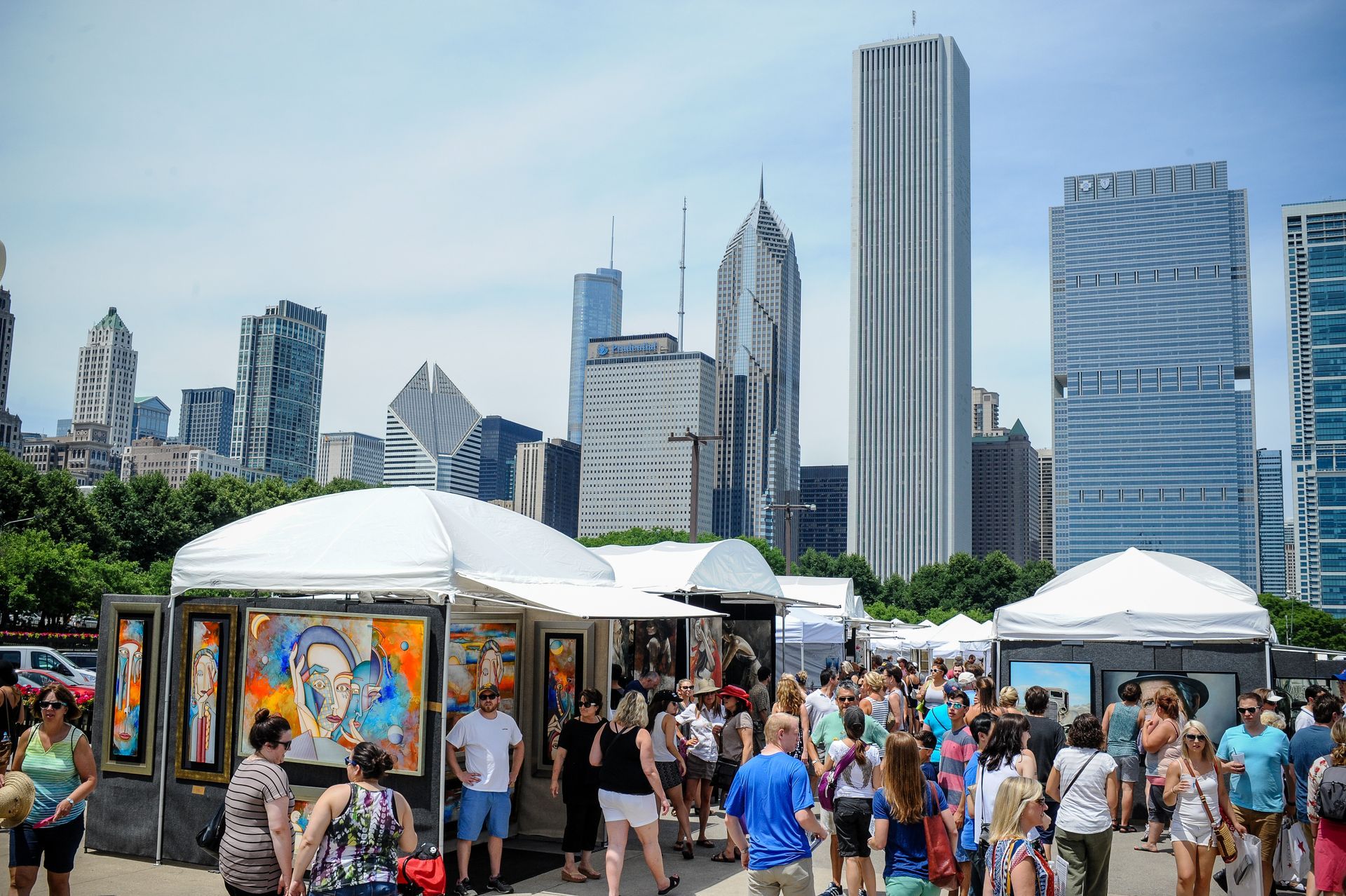 Art Fair with booth and a lot of people.
