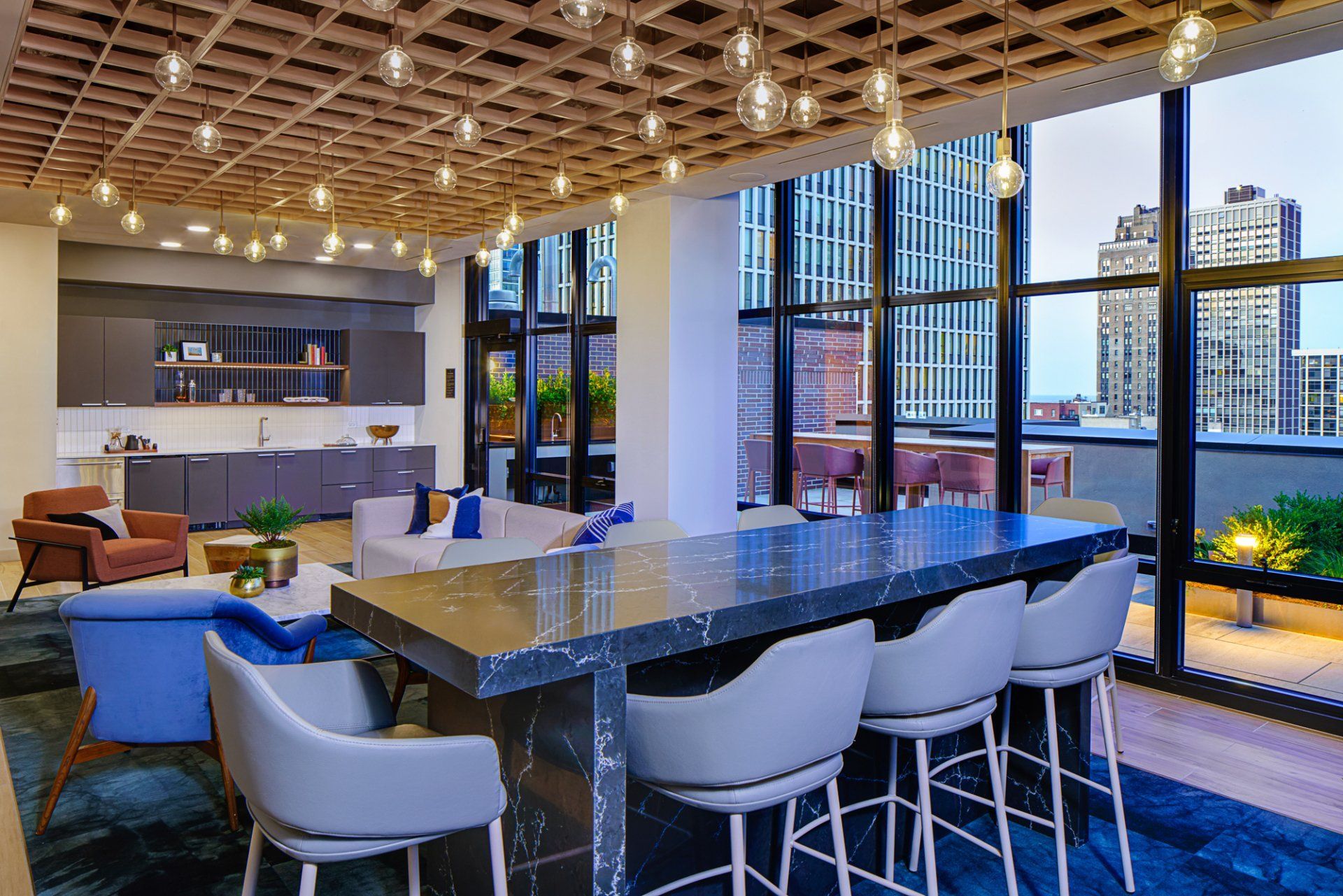 A large room with a table and chairs in it.