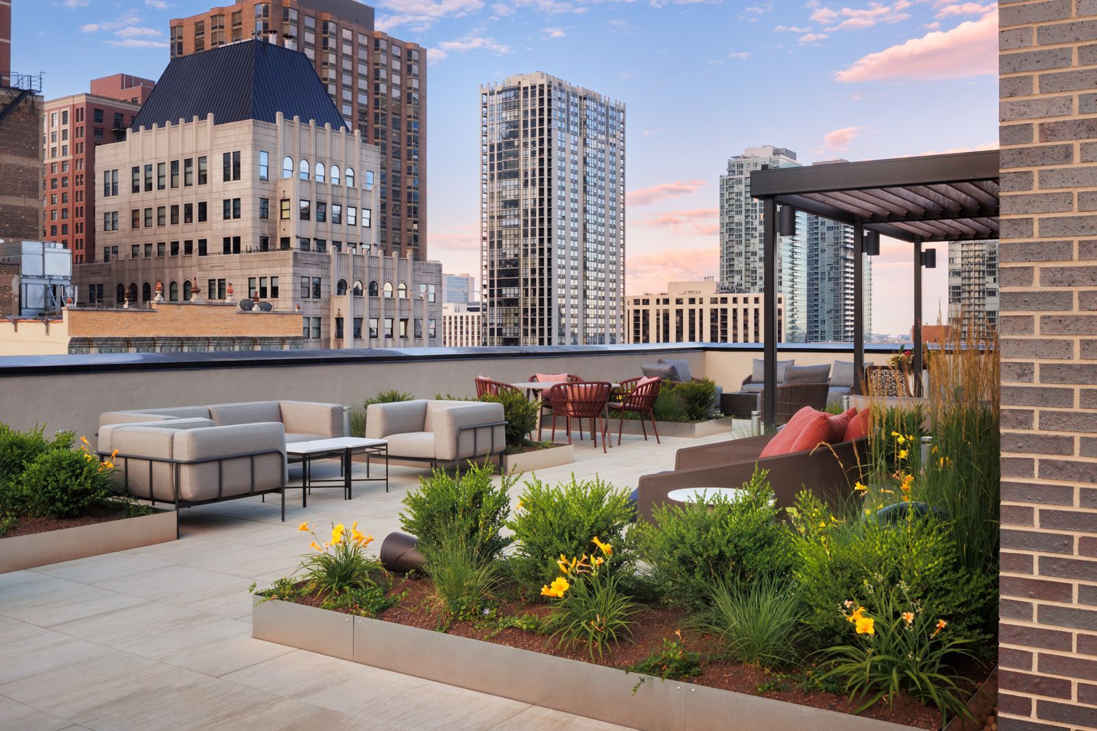 Gild apartment community rooftop deck with outdoor furniture.