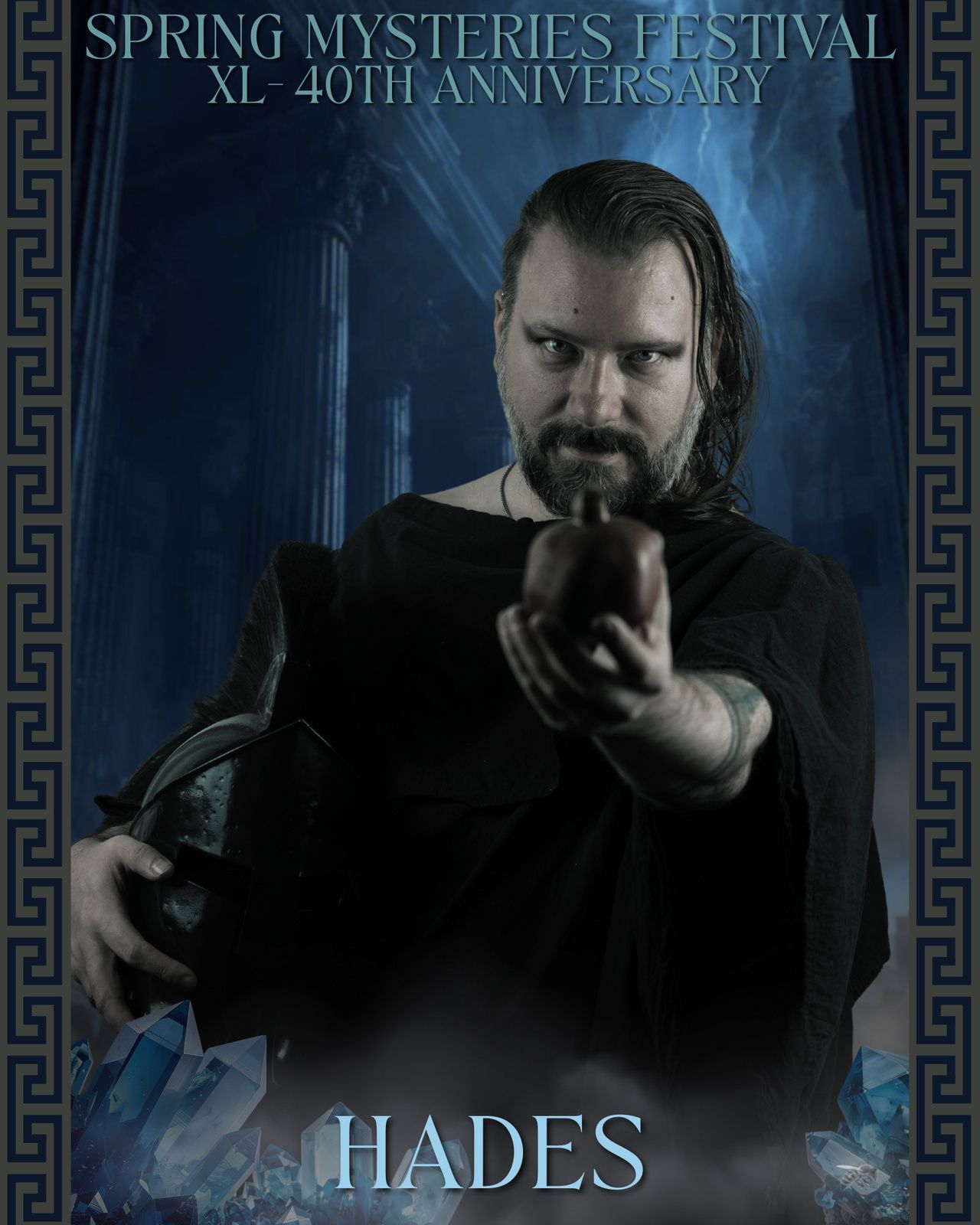 A man with a beard is holding a skull in front of a sign that says hades