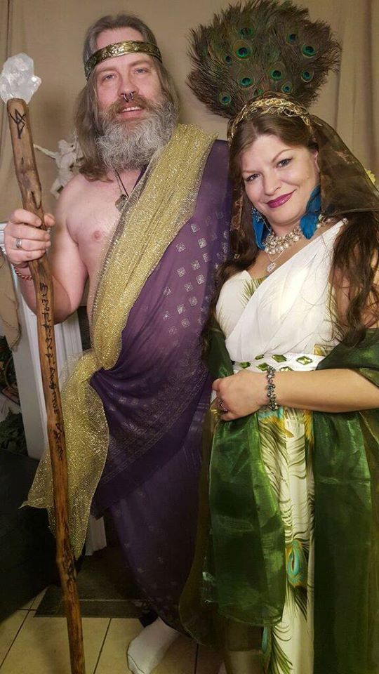 A man and a woman are dressed in costumes and posing for a picture,representing Hera and Zeus.