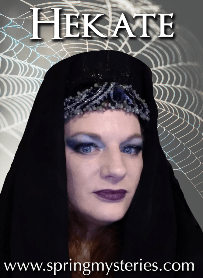 A woman wearing a black veil with the name hekate on it