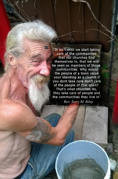 A man with a beard is kneeling down with a quote from Reverend Terry Riley.