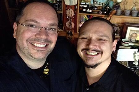 Two men smiling,  members of the Aquarian Tabernacle Church.