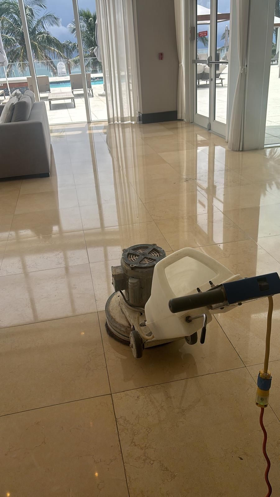 A machine is sitting on a tiled floor in a room.