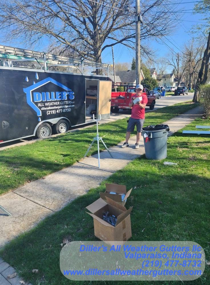 A man is standing on the sidewalk in front of a trailer.