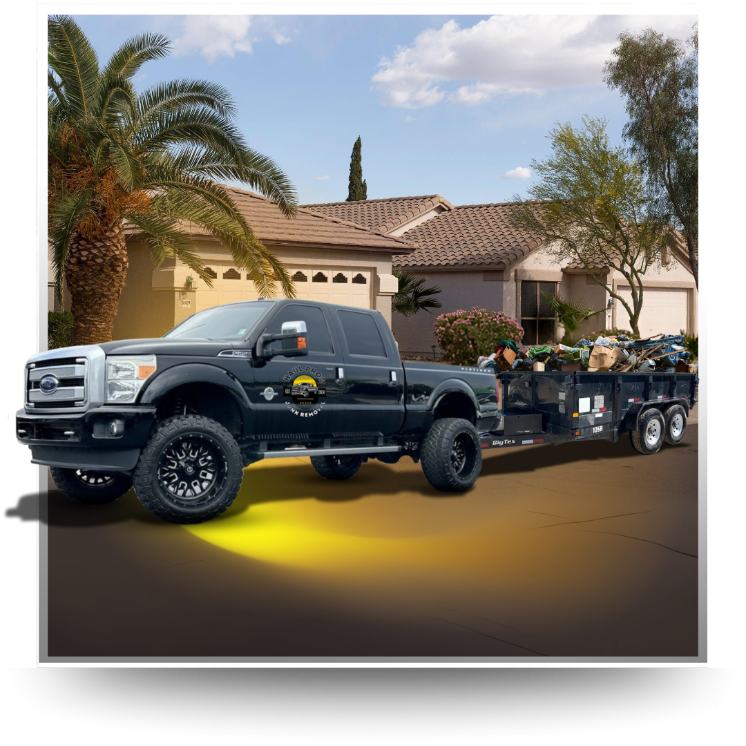 dumpster pick up truck in front of house